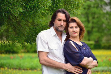 Adult male and female in  park  spring