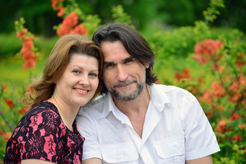 Fototapeta premium Adult male and female in park spring