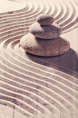 zen still life for spa and massage with sand and stones for balance and meditation with textured and contrast effects