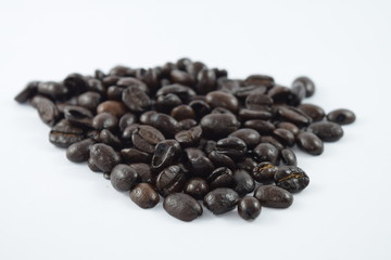 Roasted coffee beans on white background