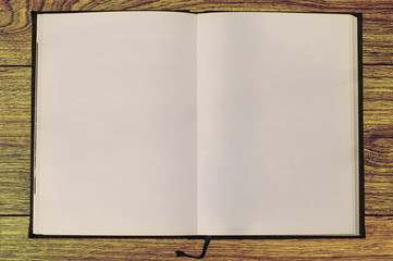 Blank notebook on wooden material