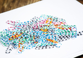 Fototapeta premium Office colored paper clips, selective focus