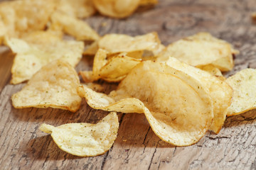 Golden potato chips, selective focus
