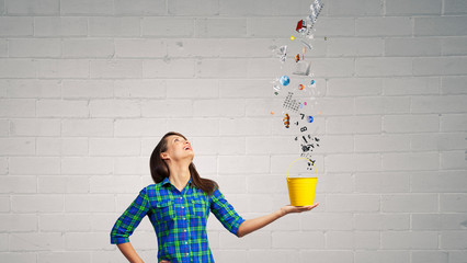 Young girl holding bucket