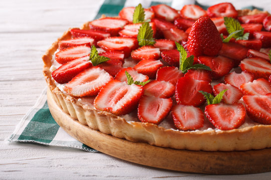 strawberry tart with cream cheese and mint closeup. Horizontal
