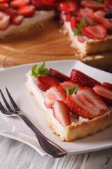 piece of strawberry tart with cream cheese close-up. Vertical
