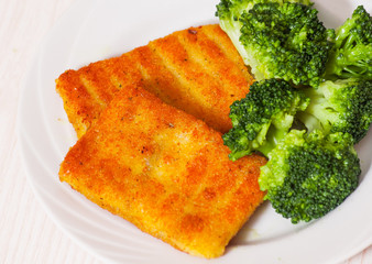 fried breaded fish fillets with broccoli