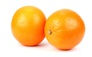 Two ripe oranges on a white background