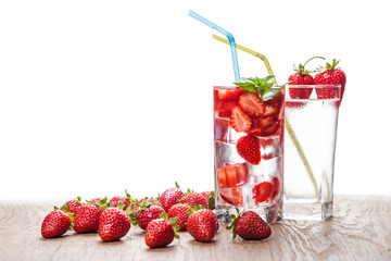 two glasses of strawberry cocktail and berries