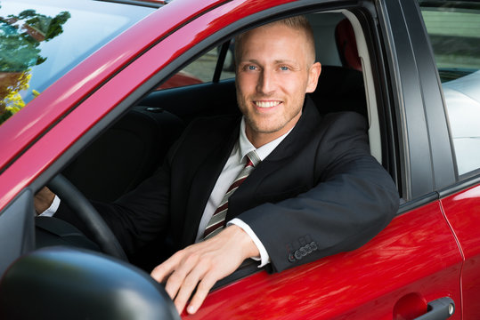 Businessman Sitting In His New Car