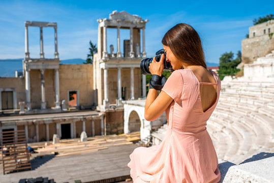 Tourist photographing Roman theater in Plovdiv