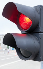 Traffic light glows red close up