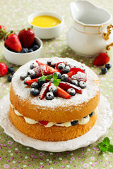 Genoise (cake) with cream, berries and lemon cream.