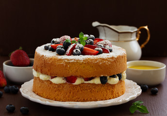 Genoise (cake) with cream, berries and lemon cream.