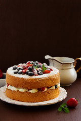 Genoise (cake) with cream, berries and lemon cream.