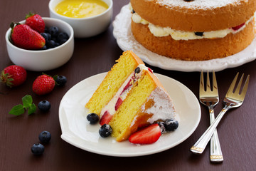 Genoise (cake) with cream, berries and lemon cream.