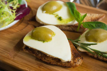 Bruschetta with tomato, mozarella and olive