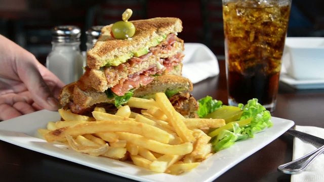 Serving a BLT sandwich in a restaurant
