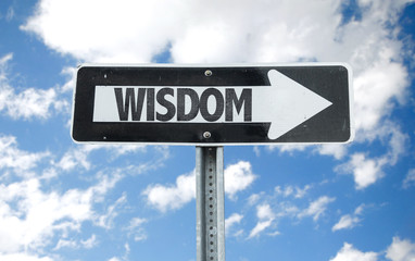 Wisdom direction sign with sky background