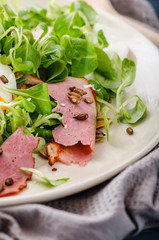 Lamb's lettuce salad with poached egg and nuts