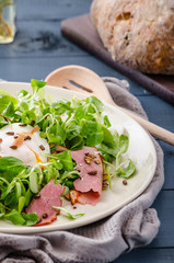 Lamb's lettuce salad with poached egg and nuts