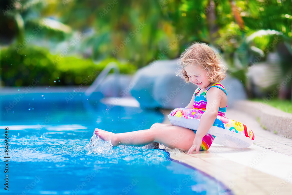 Wall mural little girl in swimming pool