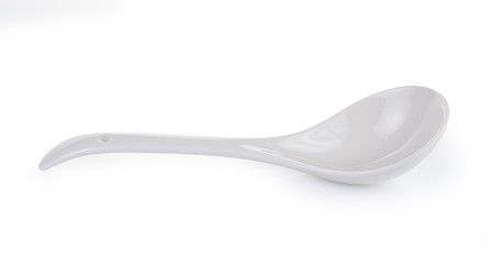 White empty ceramic spoon on white background
