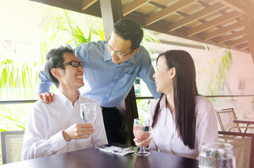 Asian business team having discussion in the restaurant