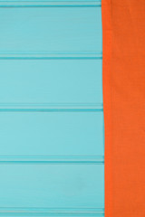 Orange towel over wooden table