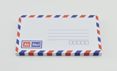Stack of air mail envelopes on white background