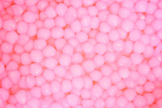 macro image of tiny pink candy sprinkle layer