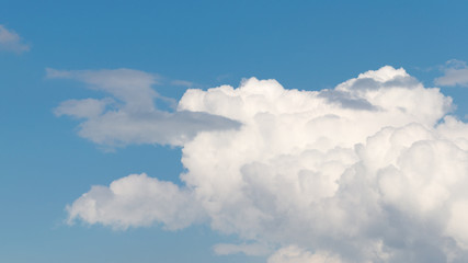 cumulus clouds in the blue sky