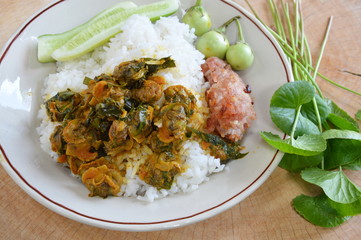 cockle curry with betel leaves and fried rice sausage
