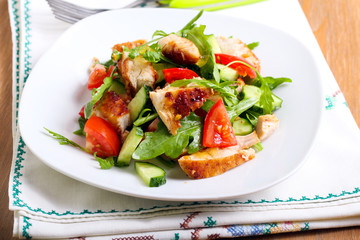 Chicken breast, rocket, cucumber and tomato salad