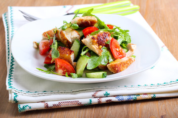 Chicken breast, rocket, cucumber and tomato salad