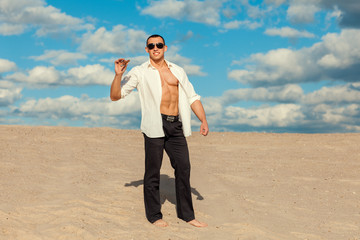 Man with cigar in the desert.