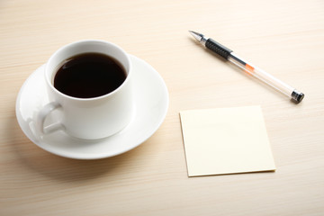 Blank note with ball pen and coffee