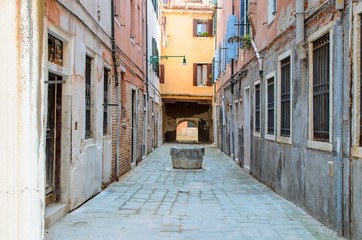 Fototapeta na wymiar Typical well in calle alley, Venice, Italy