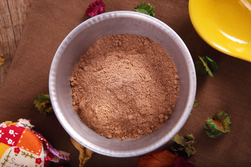 Cocoa Powder in the Bowl as Background Uses.