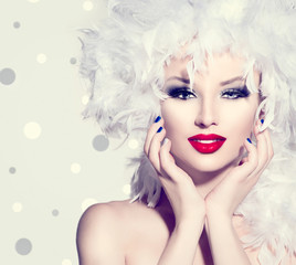Beauty fashion model girl with white feathers hairstyle