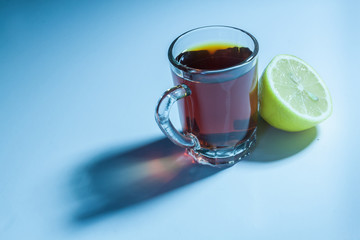 Glass of black tea and slice of lemon