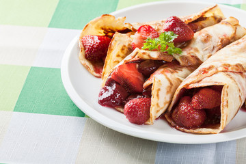 Traditional crepes served with strawberries