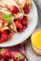 Traditional crepes served with strawberries