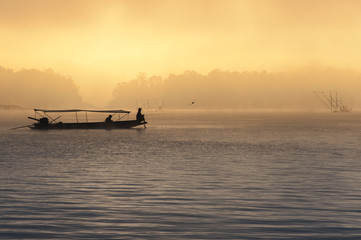 Fishing in the mist, Thailand
