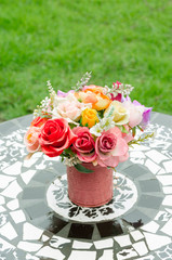 beautiful fake flowers in tin vase the decoration on table at outdoor garden