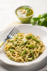 spaghetti with green beans and pesto sauce, selective focus