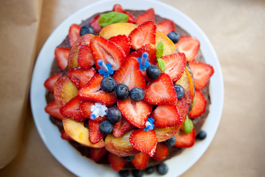 Delicious chocolate cake with fruits