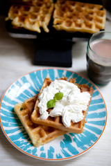 Breakfast - waffles with fresh berries and cream 