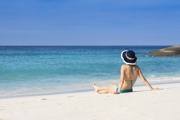Woman relaxing on paradise island beach