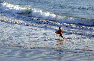 Surfer and ocean waves. 